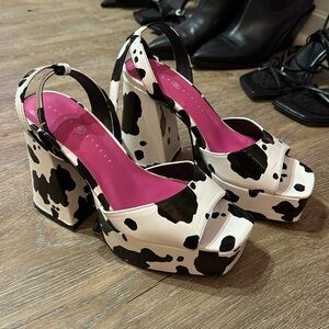 Cow print platform heels